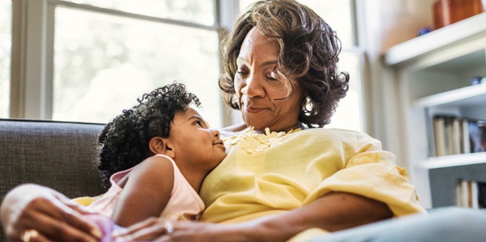 Grandmother and Granddaughter on Couch